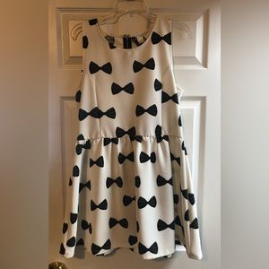 White with black bow pattern. Short and flirty